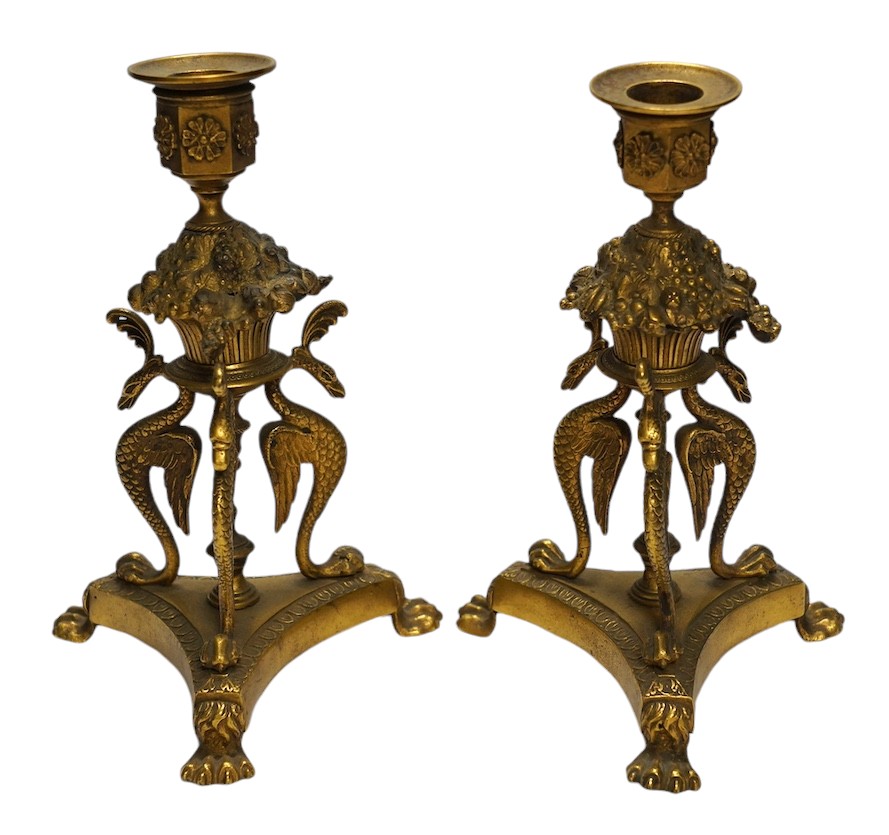 A pair of Empire style ormolu candlesticks, 20cm. Condition - fair to good